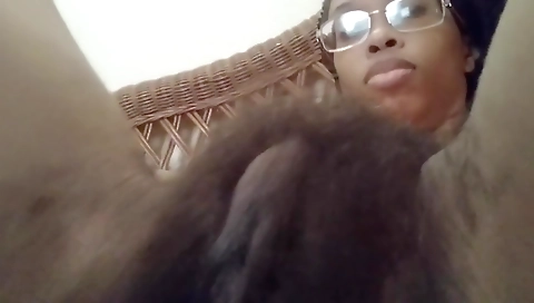 Ebony girl with natural tits fucks her hairy pussy