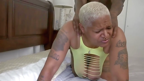 A tattooed and big boobed brunette with a massive ass is fucked