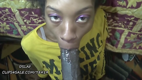 A big black cock makes a beautiful ebony face in action