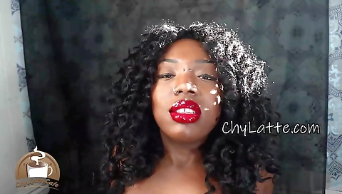 Beautiful ebony woman with huge tits and body on the couch