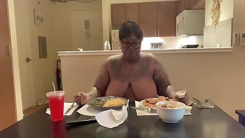 Ebony chick with a tattoo enjoys a blowjob and smoking