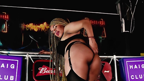 Brunette woman in stockings and stockings is dancing