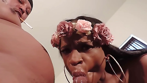 Brunette ebony girl sucks a big black cock in her mouth